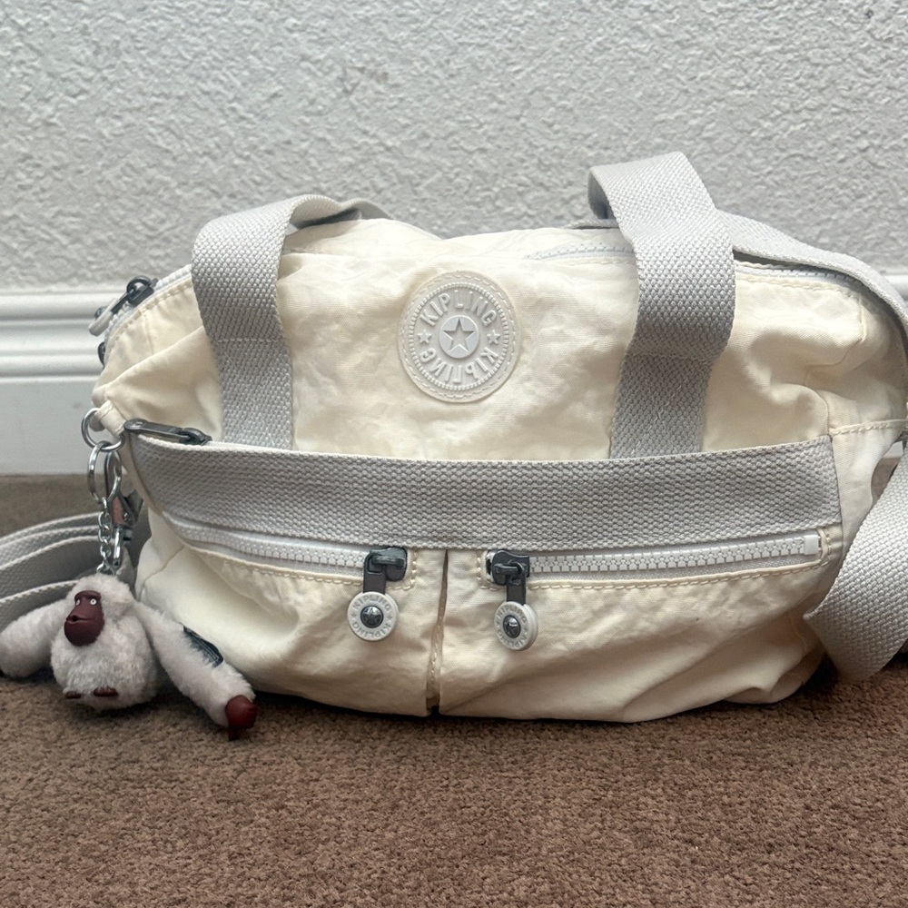 Kipling Cream Travel Bag with Monkey Keychain